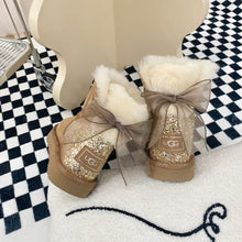 Load image into Gallery viewer, Glittery Bow Ugg Boots
