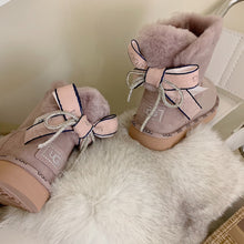 Load image into Gallery viewer, Glittery Bow Ugg Boots
