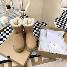 Load image into Gallery viewer, Glittery Bow Ugg Boots
