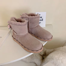 Load image into Gallery viewer, Glittery Bow Ugg Boots
